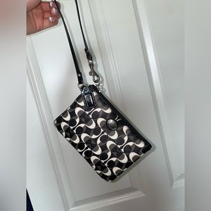 Black and white Coach wristlet wallet